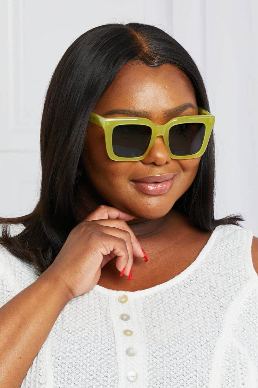 Citron box frame sunglasses with acetate material and dark lenses.