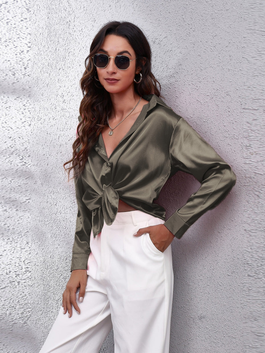 Silken button-down shirt in dark gray with a knotted front and long sleeves.