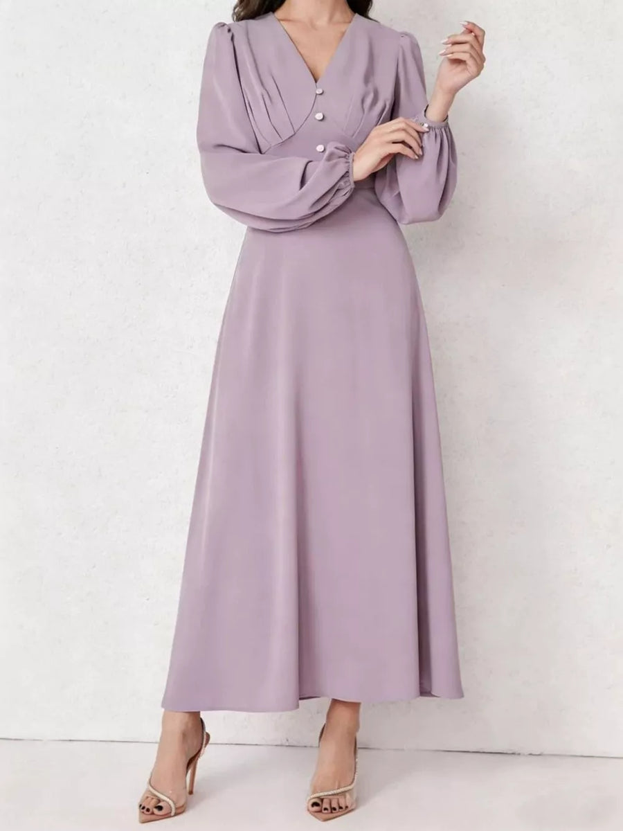 Lavender ruched maxi dress with V-neck, decorative buttons, and balloon sleeves.