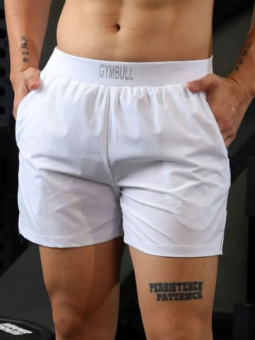 White athletic shorts with elastic waistband and pockets