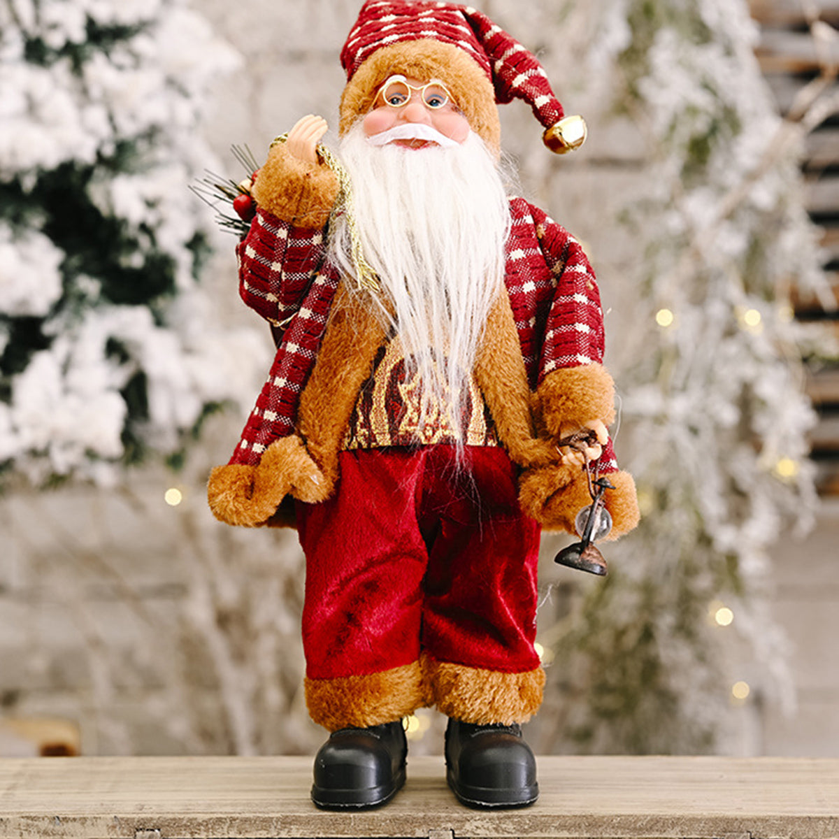 Festive Tartan Santa figurine in red with a plaid coat and gold accents, holding a lantern.