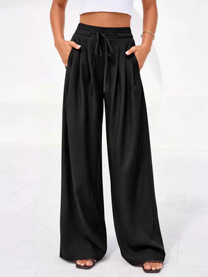 Black high-waisted pleated wide-leg pants with drawstring and pockets