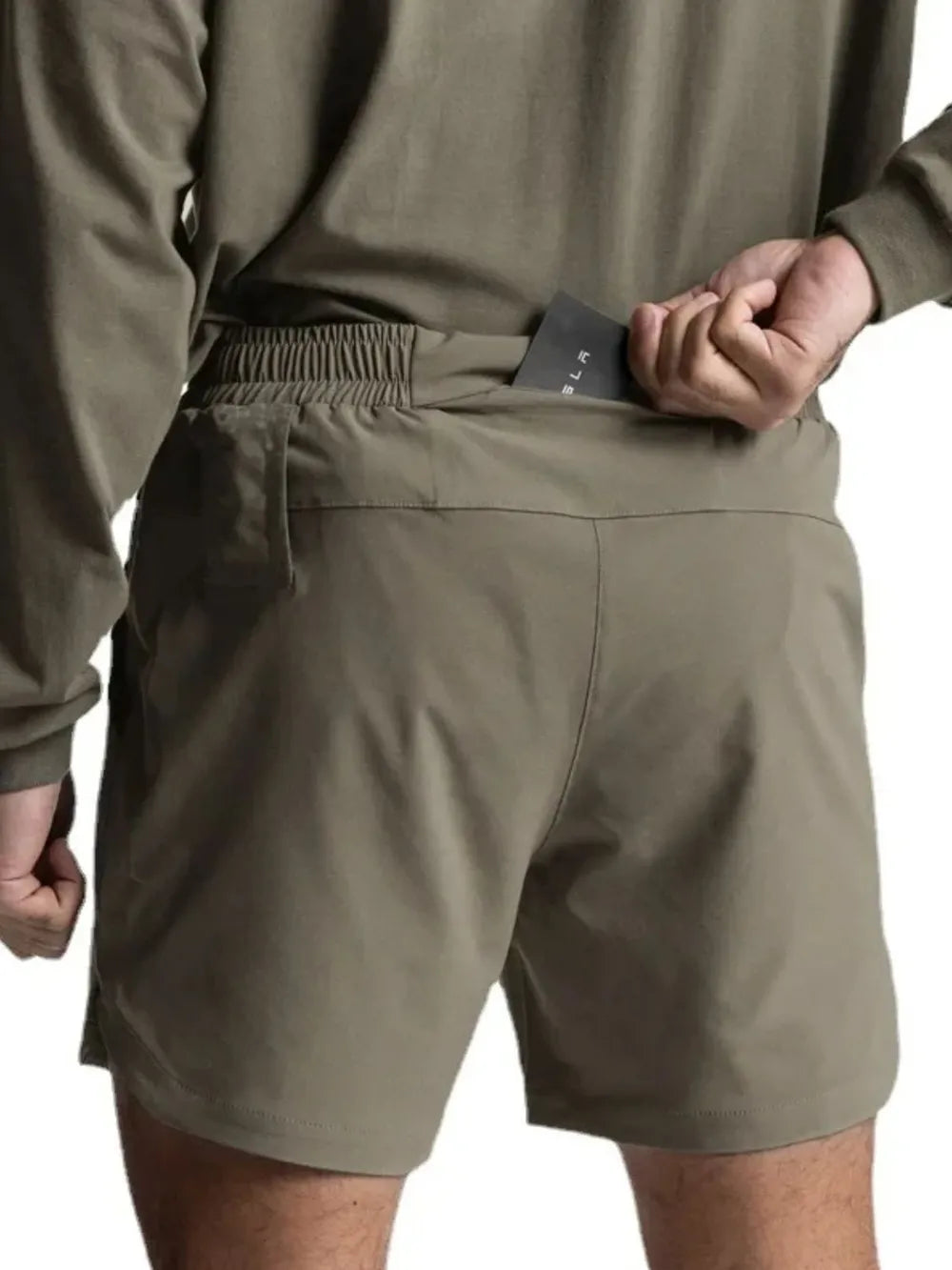 Sage performance drawstring running shorts with elastic waistband and back pocket detail.