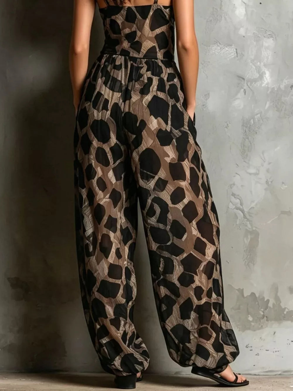 black jumpsuit with full-length and tie