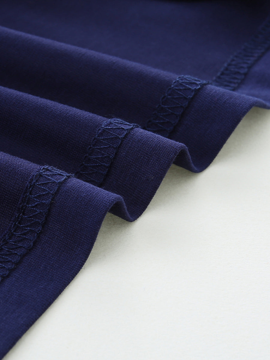 Navy blue cotton t-shirt detail showing reinforced stitching on hem and sleeves.