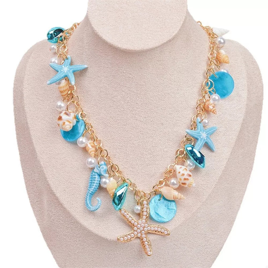 necklace in gold with charms and choker