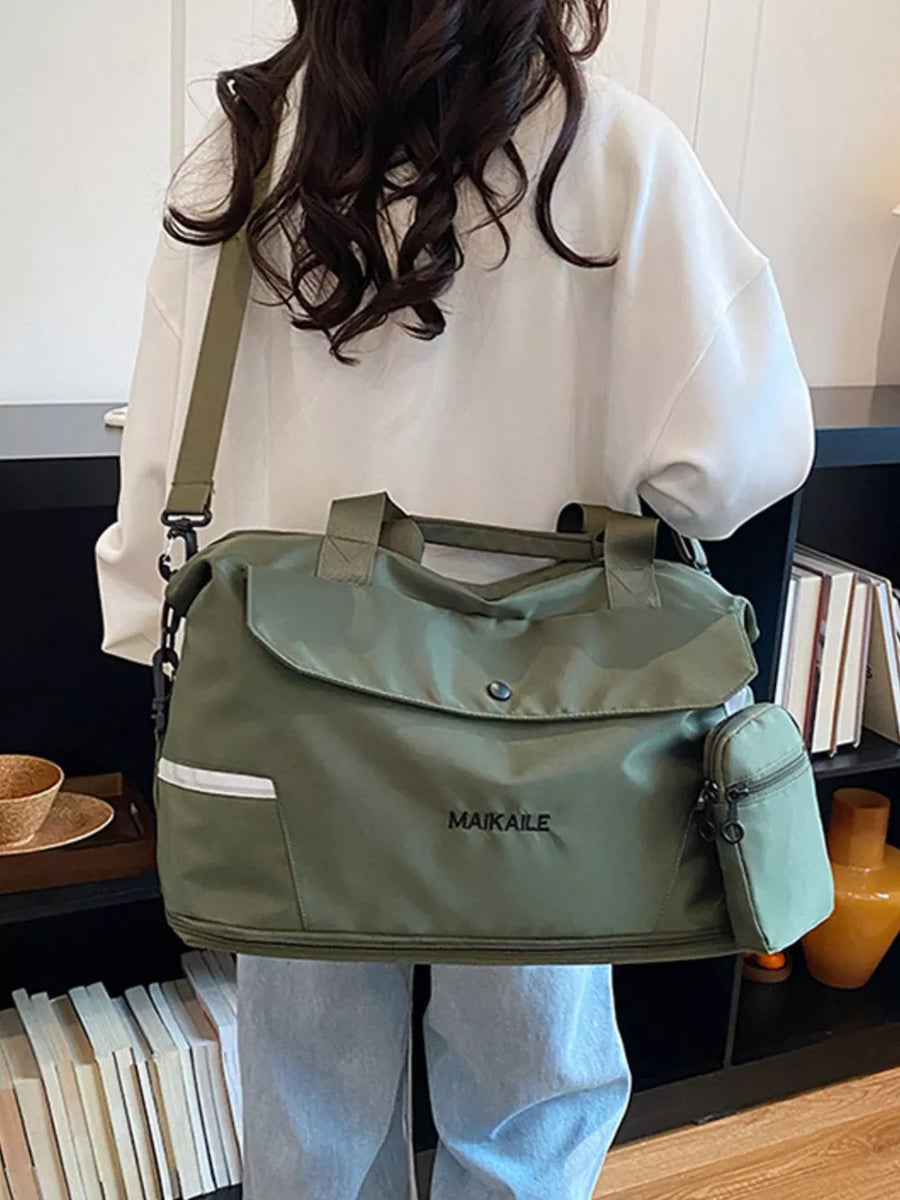 Green nylon duffel bag with MAIKAILLE logo and front pocket detail, worn crossbody.