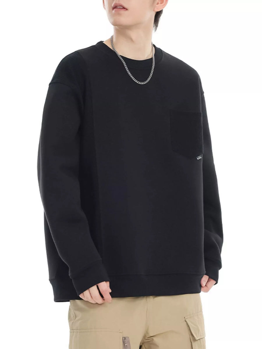 Black crewneck sweatshirt with chest pocket and textured shoulder detail.