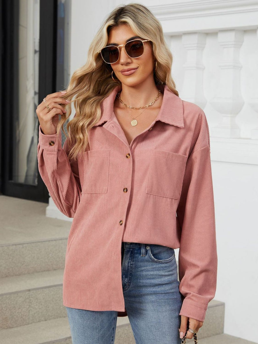 Pink corduroy overshirt with patch pockets and button front.