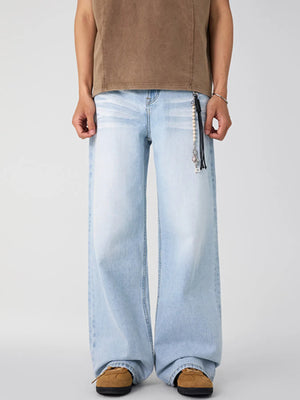 Washed wide-leg men's jeans in Glacier Blue with a beaded keychain detail.