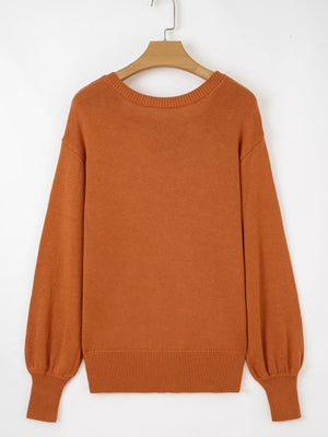Caramel acrylic blend drop shoulder sweater with balloon sleeves and ribbed cuffs.