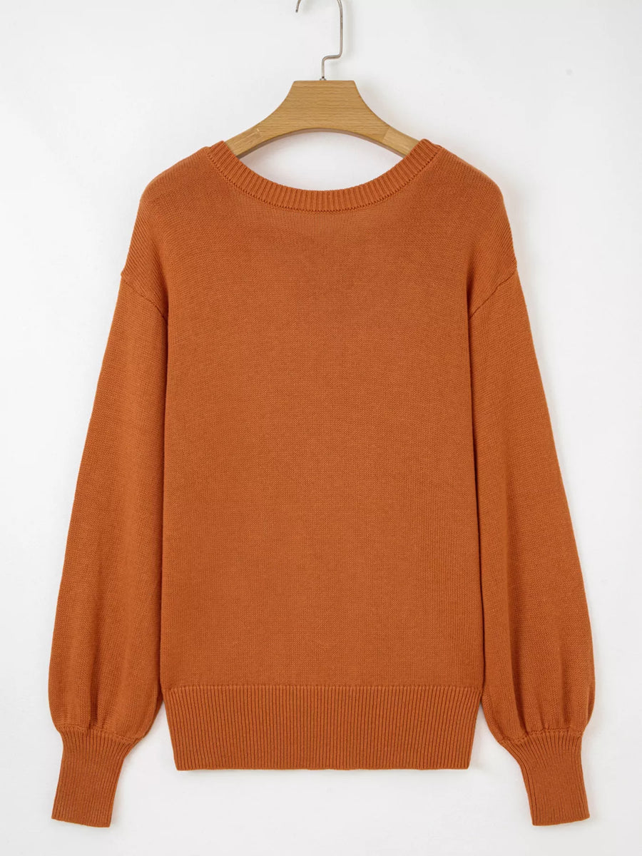 Caramel acrylic blend drop shoulder sweater with balloon sleeves and ribbed cuffs.