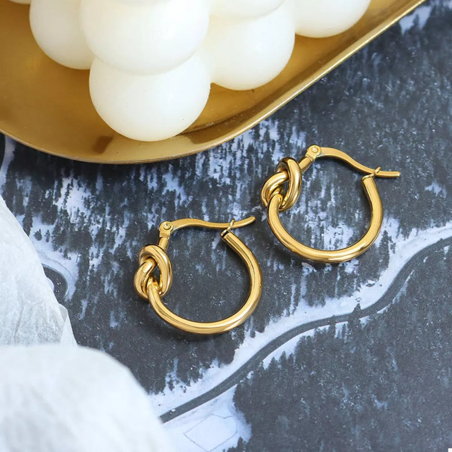 Gold knot hoop earrings with 18K gold plating.