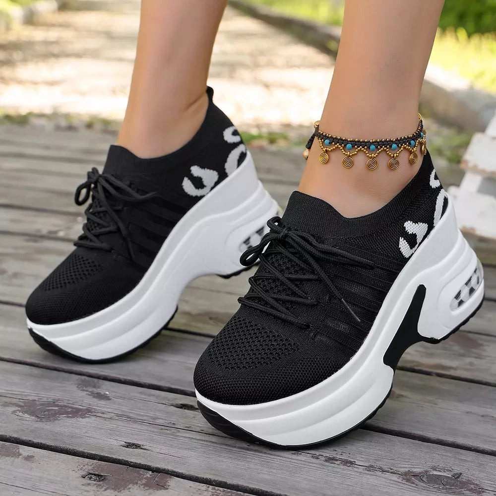 white sneakers featuring round toe and leopard-print