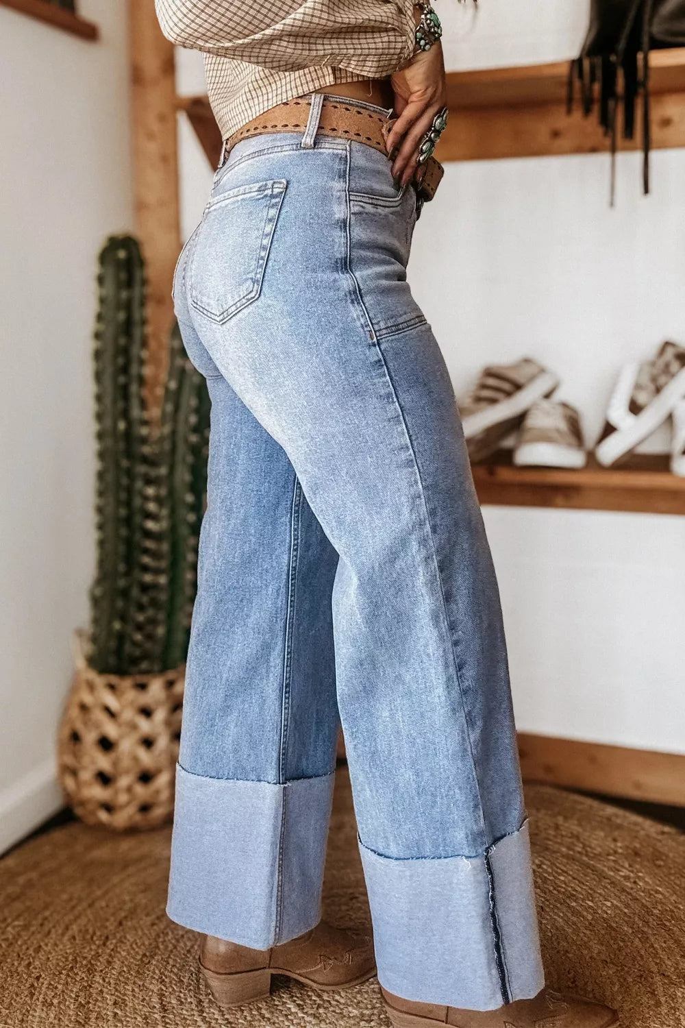 Light wash denim wide leg jeans with large cuffs