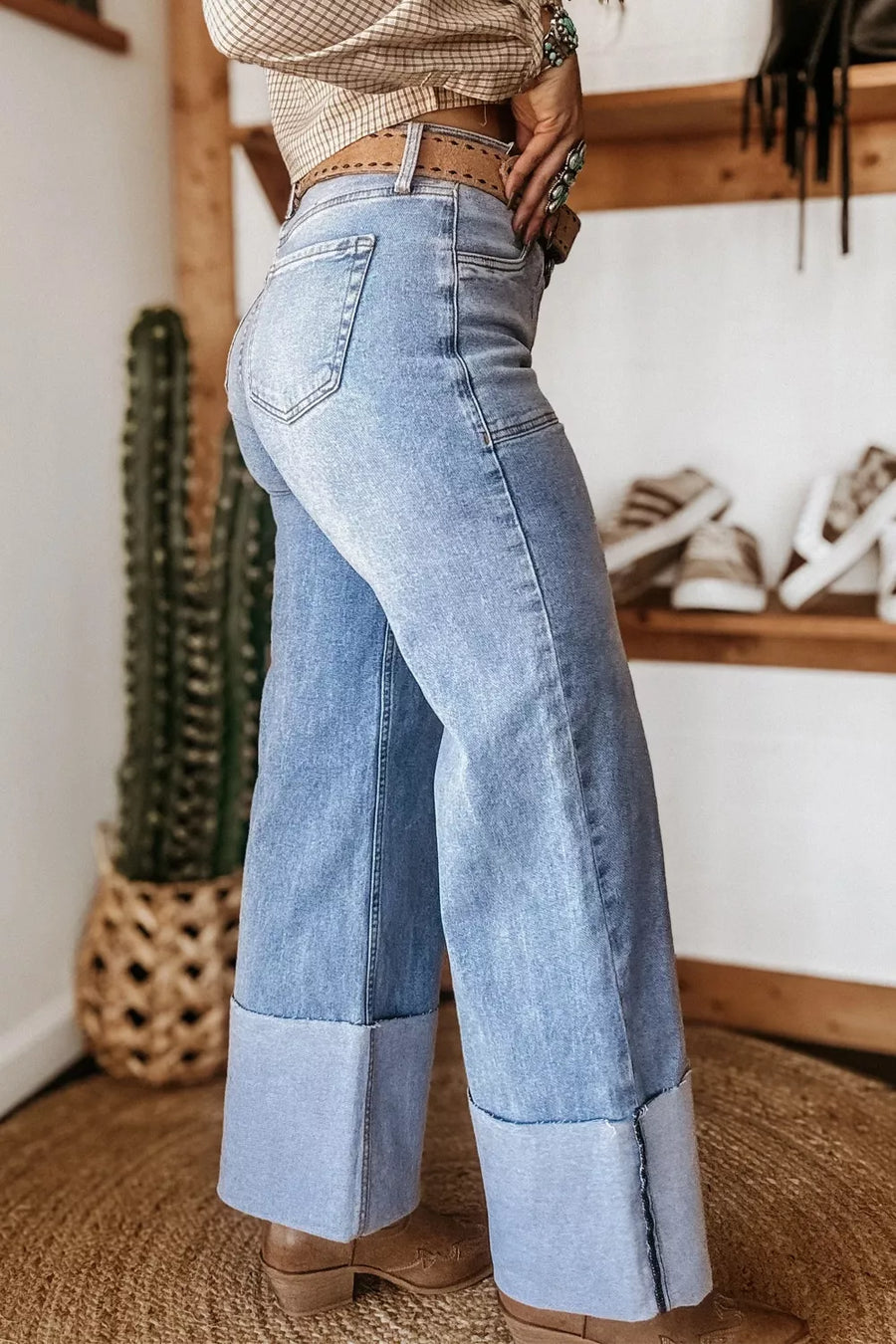 Light wash denim wide leg jeans with large cuffs