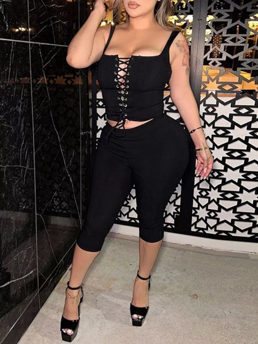 Black ribbed lace-up tank top and capri pants ensemble