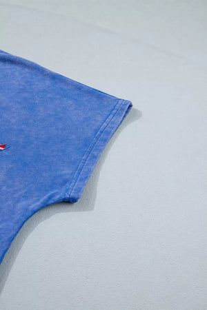Blue cotton t-shirt with patriotic star appliqué and notched neckline detail.