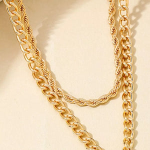 gold necklace with cross pendant and n/a