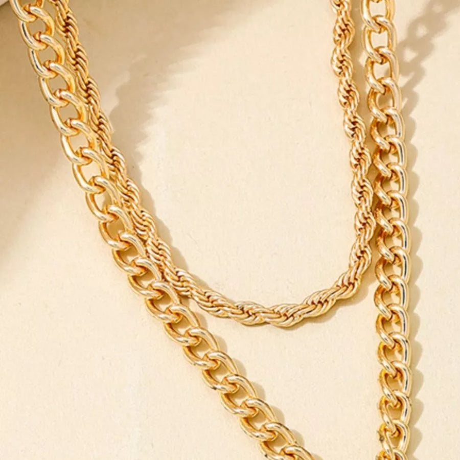 gold necklace with cross pendant and n/a