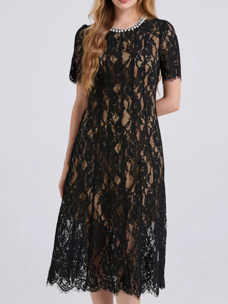 Black lace midi dress with pearl-embellished neckline and short sleeves.