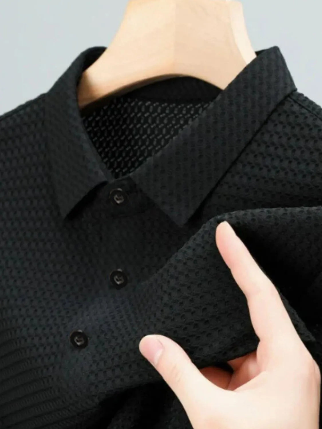 Black textured pique polo with refined collar and button detail
