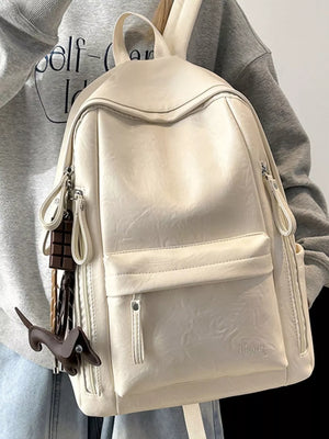 Chic pu leather medium backpack in white with cute dachshund and chocolate bar charms.