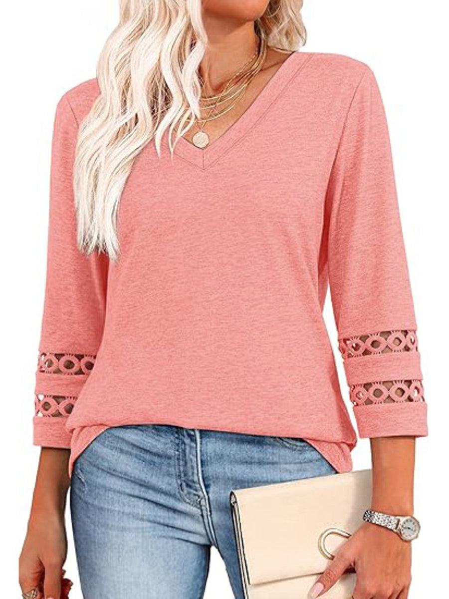 Pink V-neck t-shirt with 3/4 sleeves featuring cutout detail at the cuffs.
