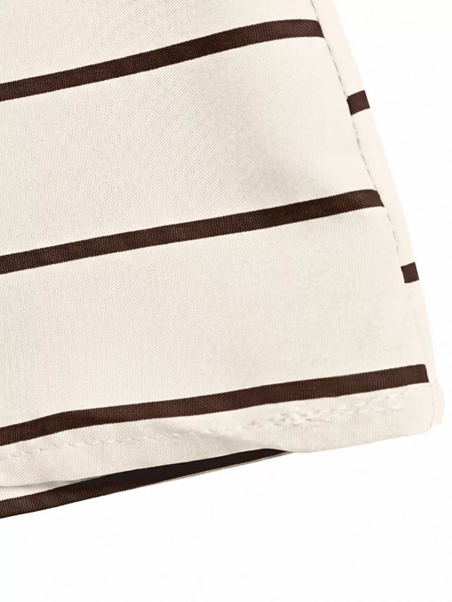 Patterned maxi dress with brown stripes and smocked detail.