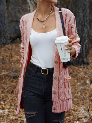 Carnation Pink cable knit cardigan with button front and pockets.