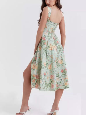 Floral midi dress in sage with side slit and corset back detail.