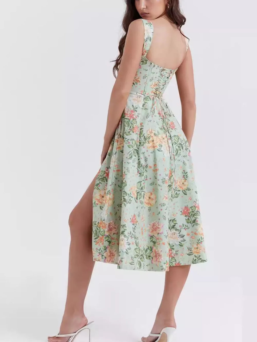Floral midi dress in sage with side slit and corset back detail.