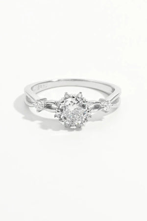 Silver halo ring with round cut zirconia and floral accents