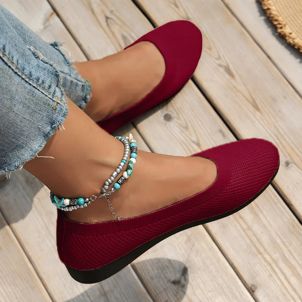 Burgundy textured knit slip-on flats with a round toe and beaded anklet.
