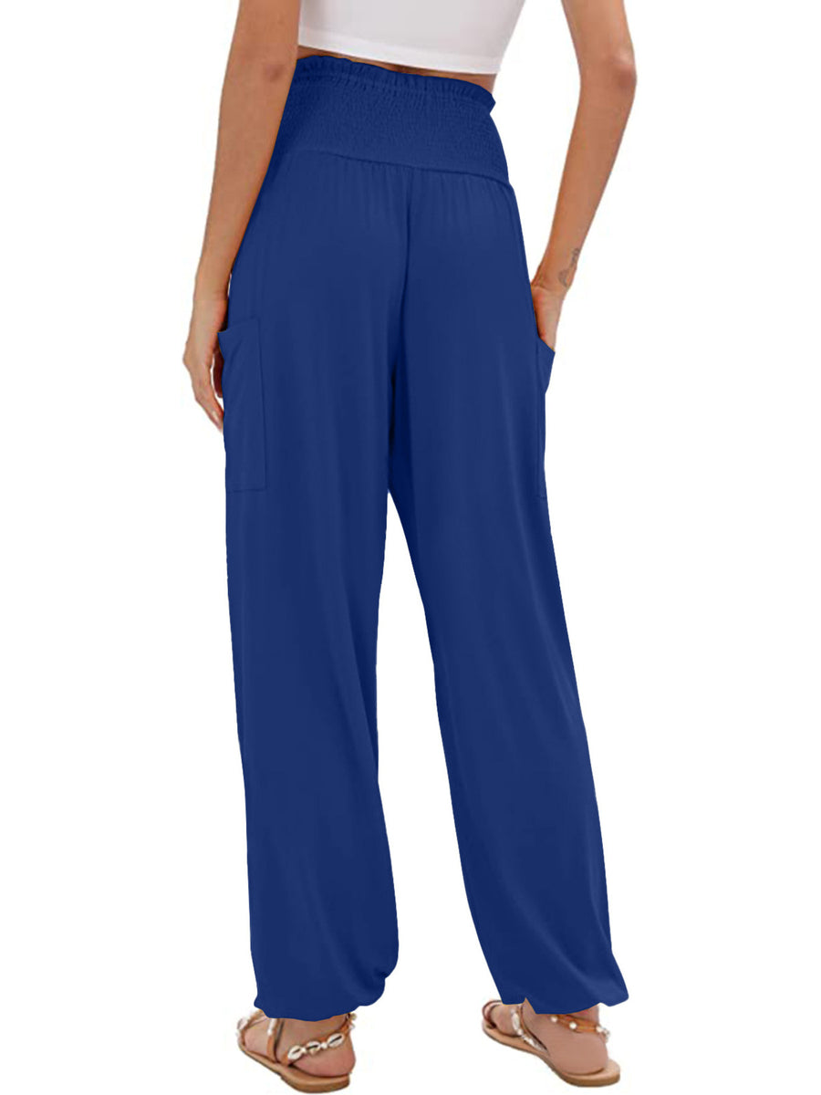 Blue smocked waist harem pants with pockets and ankle cuffs.