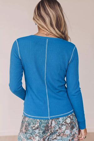 Blue henley featuring ribbed knit and ribbed