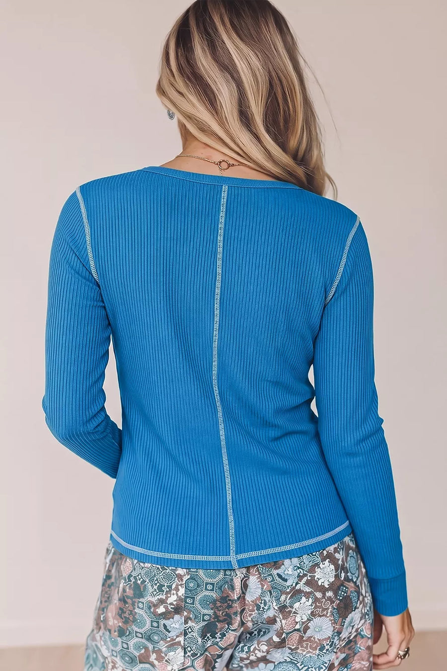 Blue henley featuring ribbed knit and ribbed