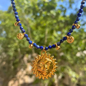 gold necklace with pendant and not applicable