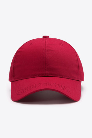 Red cotton twill baseball cap with adjustable strap detail.