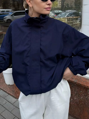 windbreaker in navy blue featuring pocketed and oversized fit