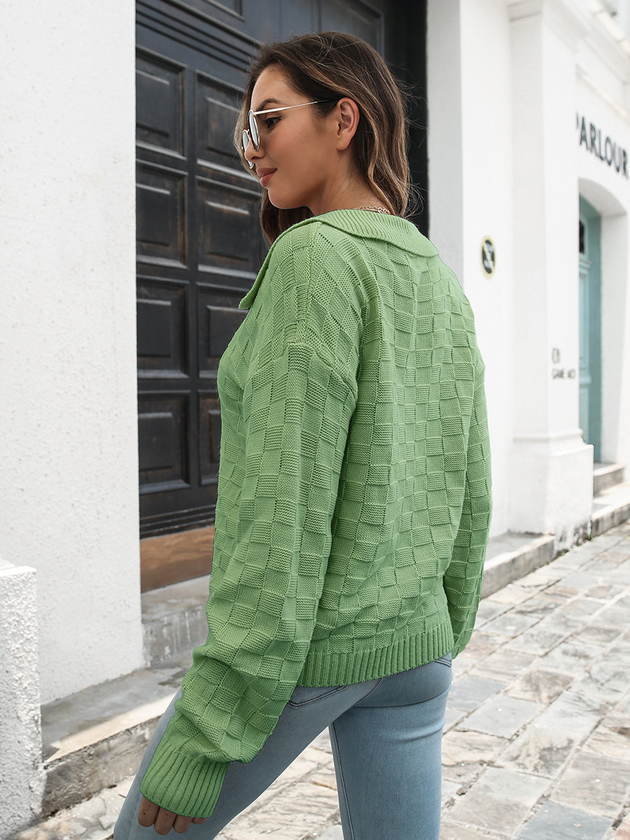 Matcha green acrylic knit sweater with textured squares and polo neckline.