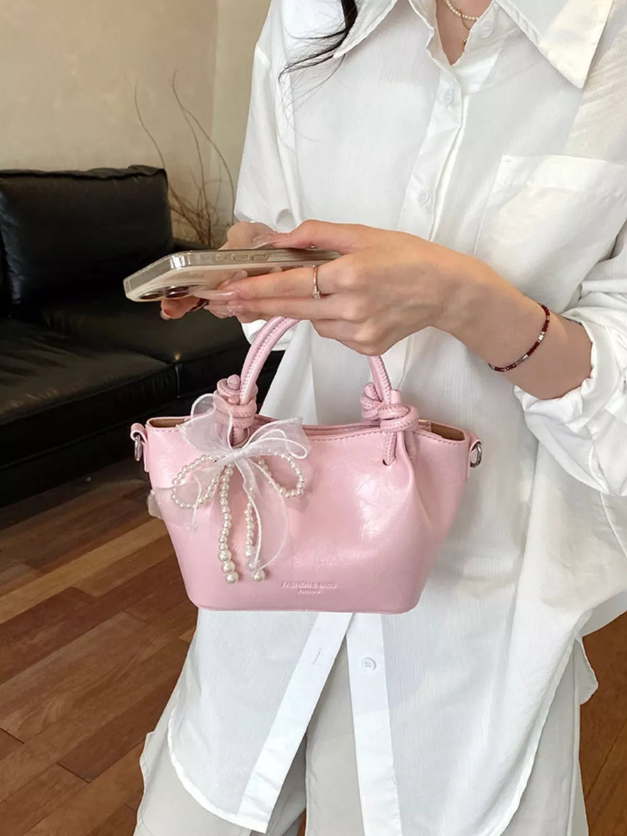 PU Leather Imported Size &amp crossbody bag in light pink with structured silhouette