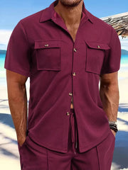 Burgundy textured resort shirt with patch pockets and button closure.