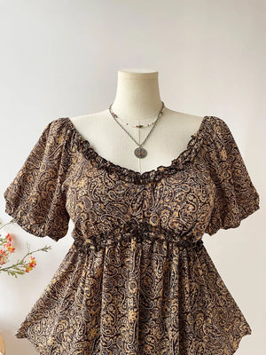 Plus size coffee brown paisley print blouse with ruffled neckline and smocked waist.