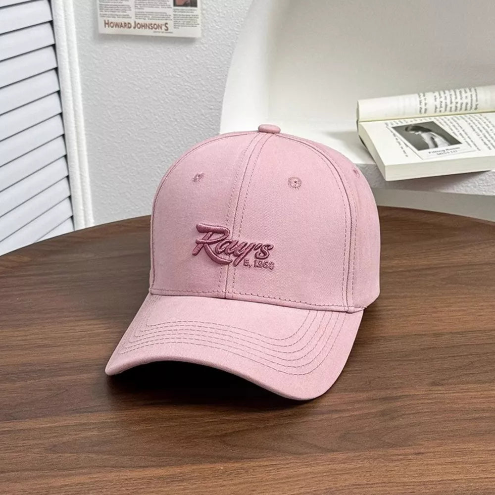 Blush pink baseball cap with embroidered "Ray's Est. 1968" detail