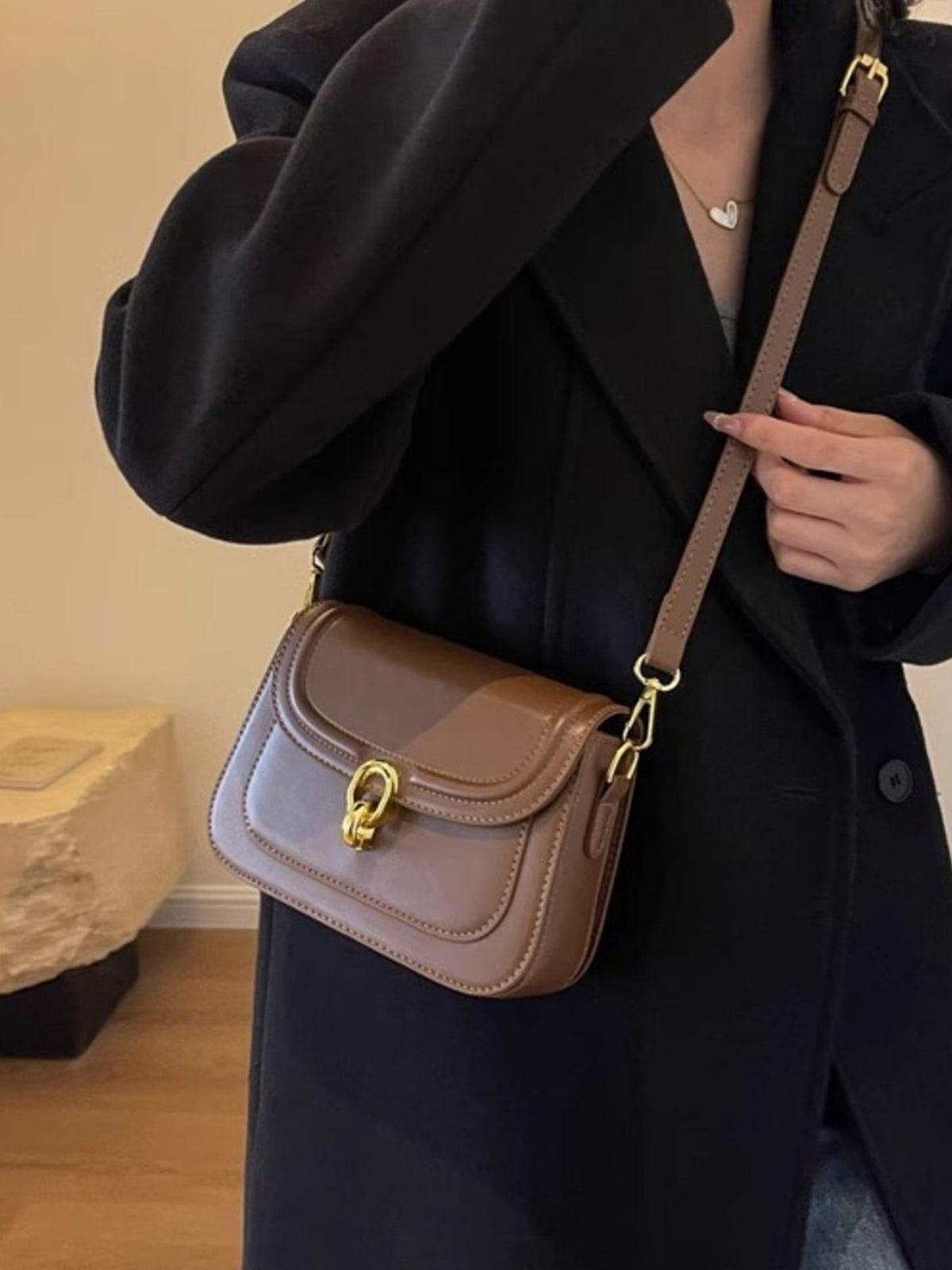 Premium pu leather flap crossbody bag in coffee color with gold hardware.