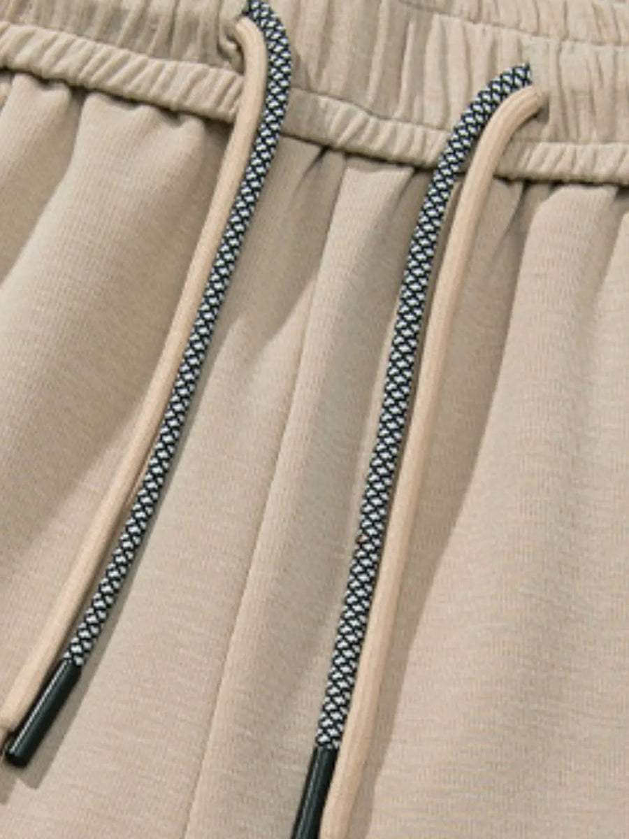 Khaki lounge trousers with drawstring detail and elastic waistband
