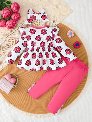 peplum top in Rose Red with floral and decorative button