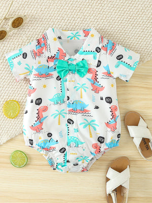 White cotton baby bodysuit with colorful dinosaur print and teal bow tie.
