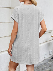 Light Gray eyelet mini dress with diamond pattern, crew neck, short sleeves, and A-line cut.
